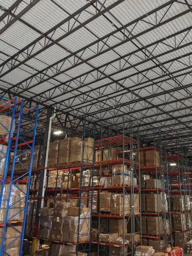Pallet racking stacked with inventory inside the PrimePort warehouse